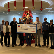 Chevron donates a $10,000 check to Toys for Tots